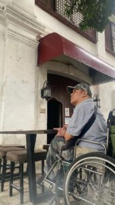 Joel in front of an old coffee shop in Ilocos