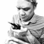 Joel is monitoring his handheld two-way radio transmission