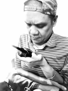 Joel is monitoring his handheld two-way radio transmission